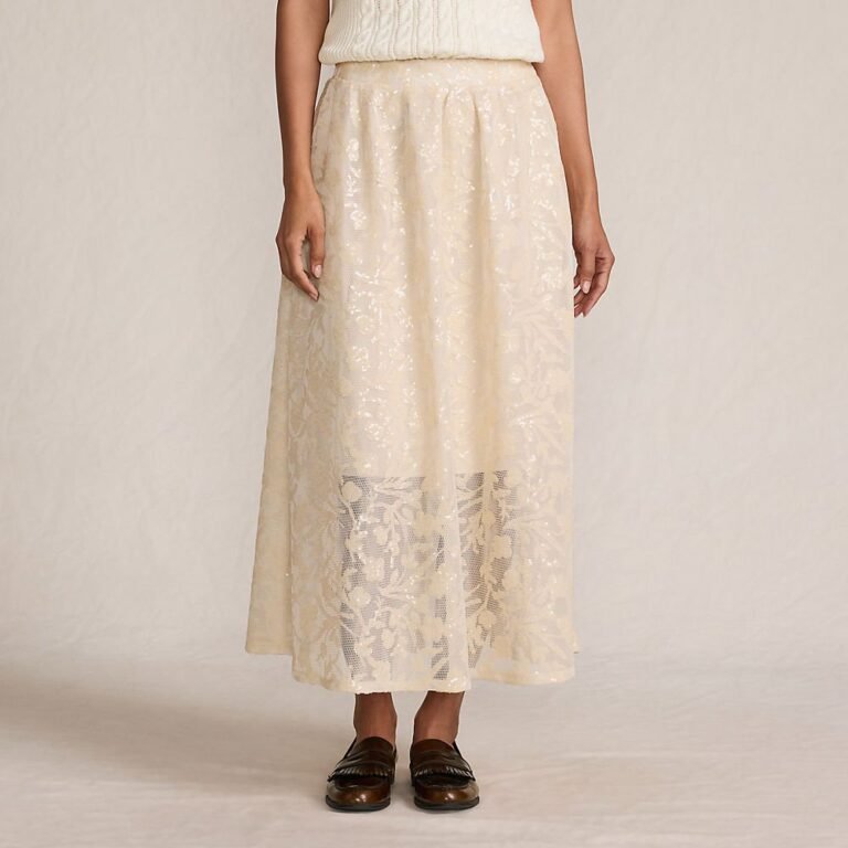 Champagne sequin lace midi skirt, an easy sparkle piece for holiday outfits for women over 50, worn with a cream knit and loafers.