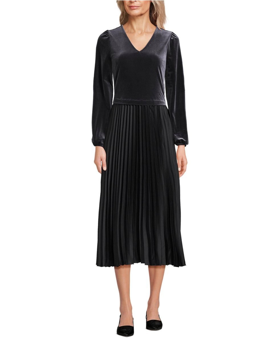 Black velvet and satin duet midi dress with a V neck velvet bodice, long sleeves and a pleated satin skirt.
