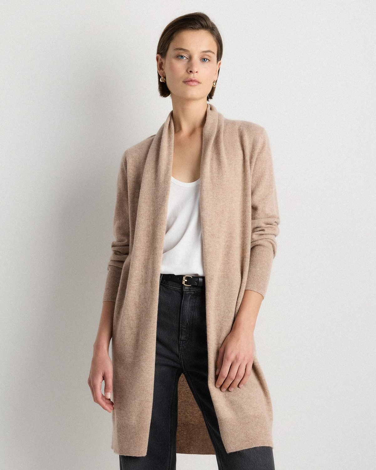 Long oatmeal cashmere duster cardigan worn open over slim black pants, a fall outfit for a woman over 50.