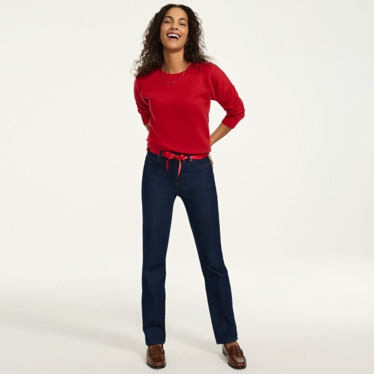 Woman over 50 wearing dark wash high rise straight leg jeans, the first piece of a fall capsule wardrobe women over 50 can wear all season.
