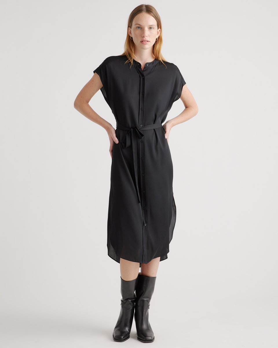 Black washable silk midi shirt dress from Quince with a band collar, button front and tie belt, worn with black boots