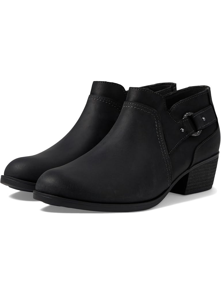 Low black leather bootie with a side buckle and a block heel, a dressier fall boot for women over 50.