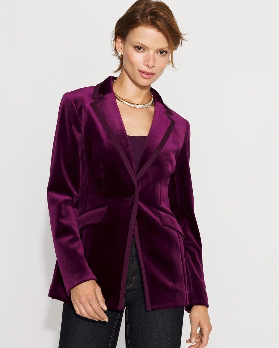 Deep plum velvet one button blazer with satin trimmed lapels worn over dark denim, for women over 50.
