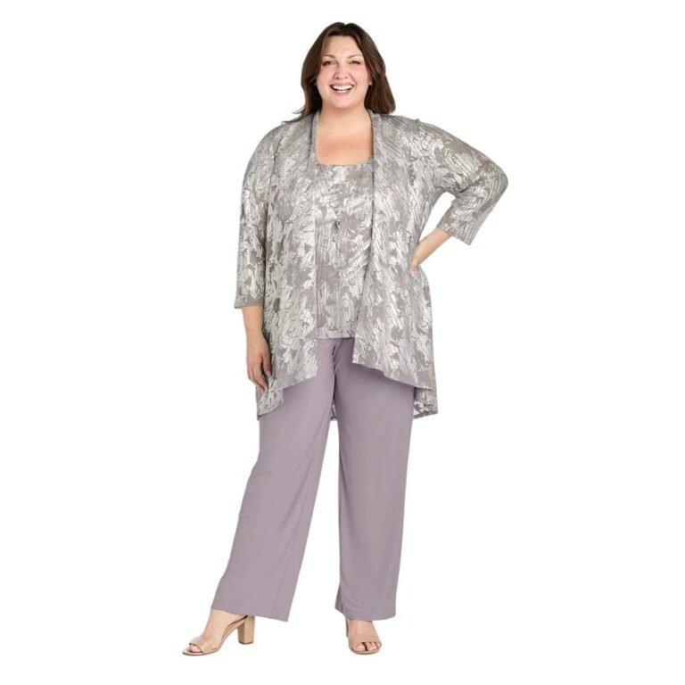 Wedding guest outfits for women over 50 can skip the dress: a silver metallic jacket, top and lavender chiffon pants set worn by a plus size model.