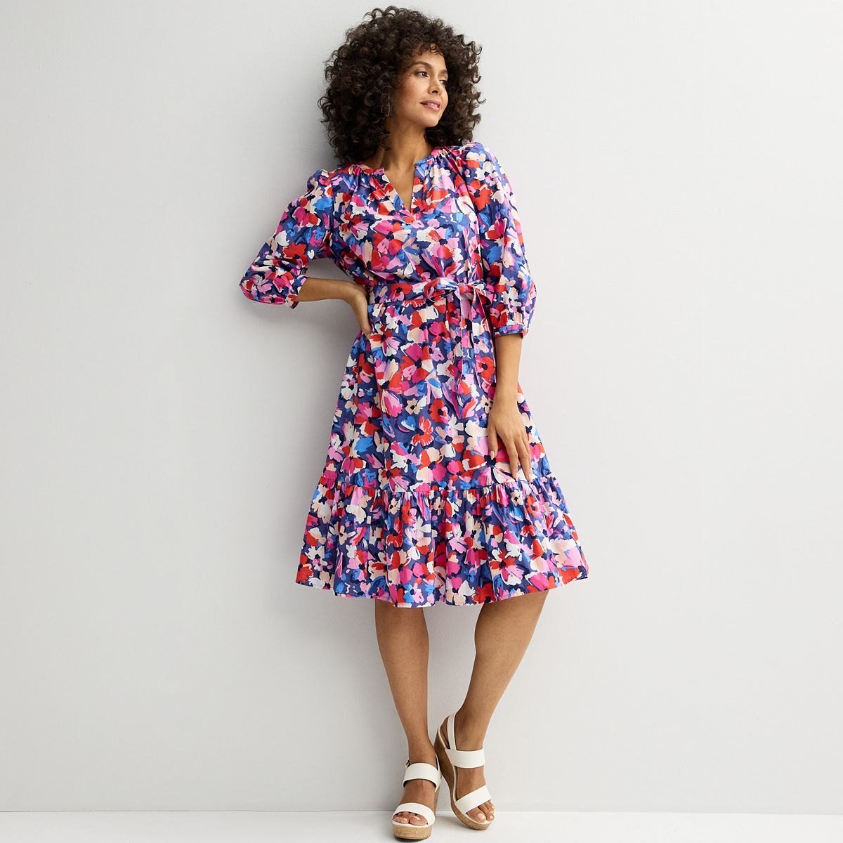 Bright pink and blue floral cotton midi dress with three-quarter sleeves, a tie sash and a tiered hem.