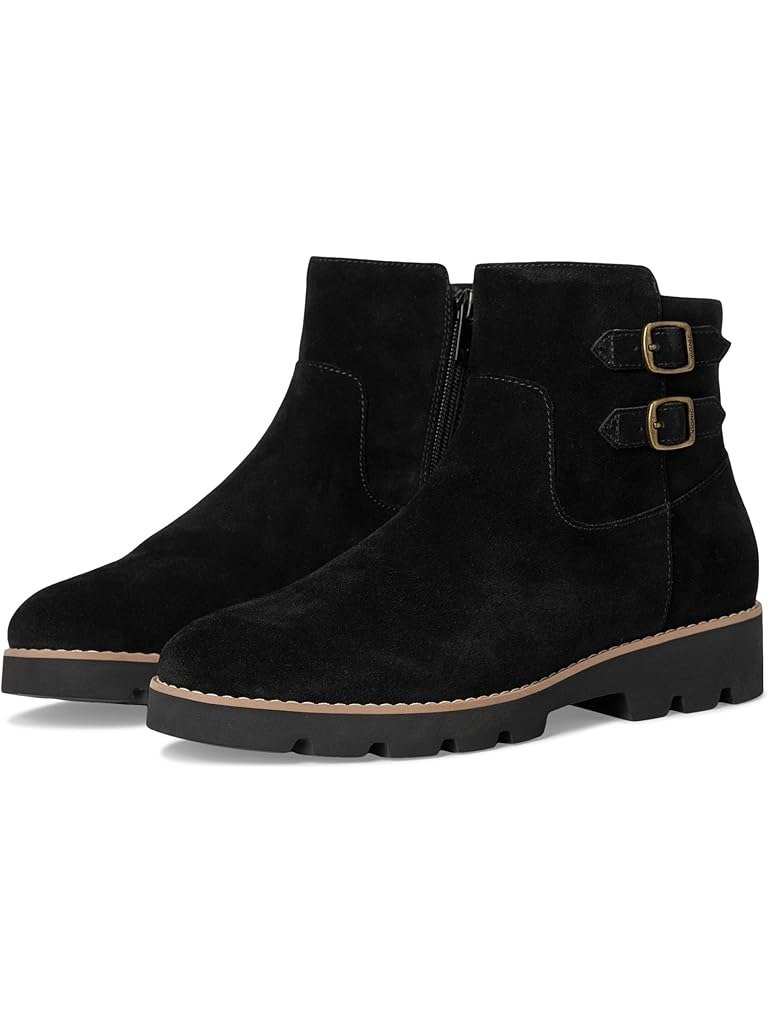 Black suede ankle boot with double buckle straps and a lug sole, with arch support built in.