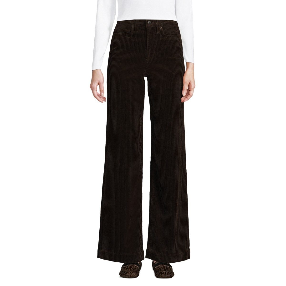 Woman over 50 wearing high rise corduroy wide leg pants with a tucked in turtleneck and ankle boots, a fall outfit.