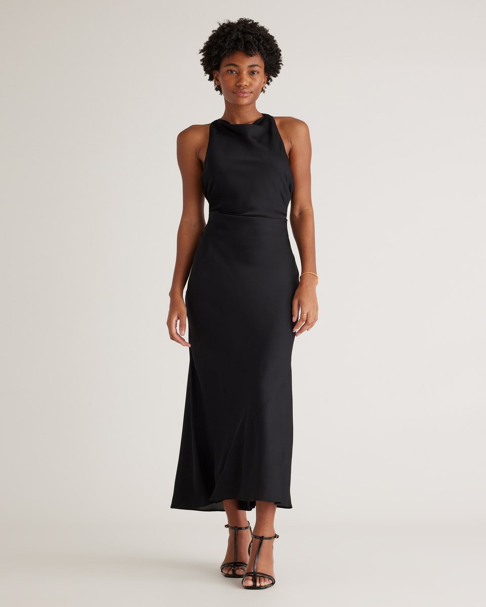 Black washable silk high neck midi dress from Quince, sleeveless with a seamed waist, worn with strappy heels