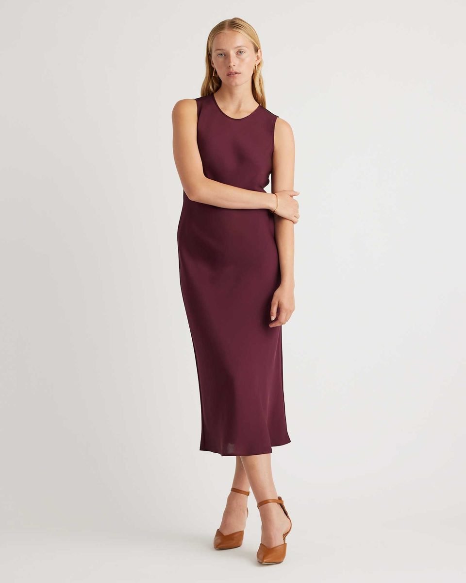 Deep wine sleeveless silk tank midi dress with a higher neckline and a bias cut skirt that skims the body.