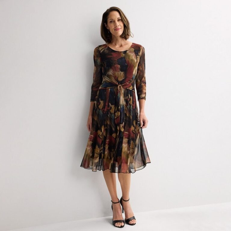 Dark rust and navy printed mesh midi dress with three-quarter sleeves and a tie front waist.