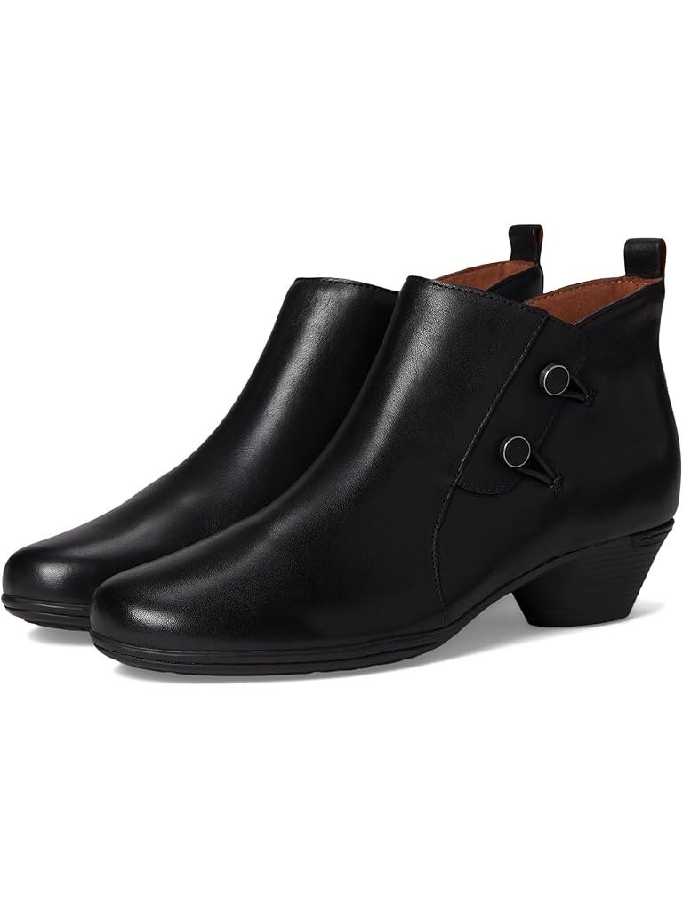 Black leather low bootie with side ring tabs and a small heel, in narrow, medium and wide widths.