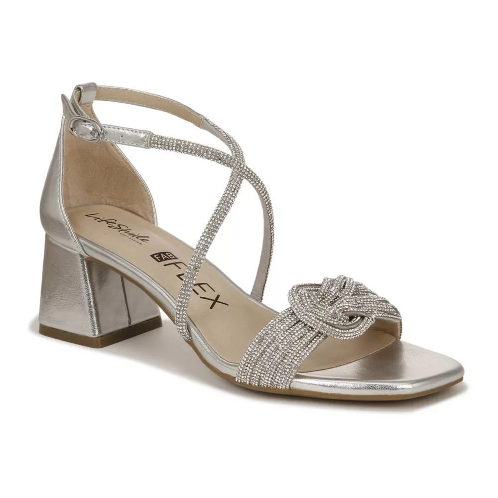 Silver block heel sandals with a rhinestone knot strap and an ankle strap, made for standing and dancing for hours.