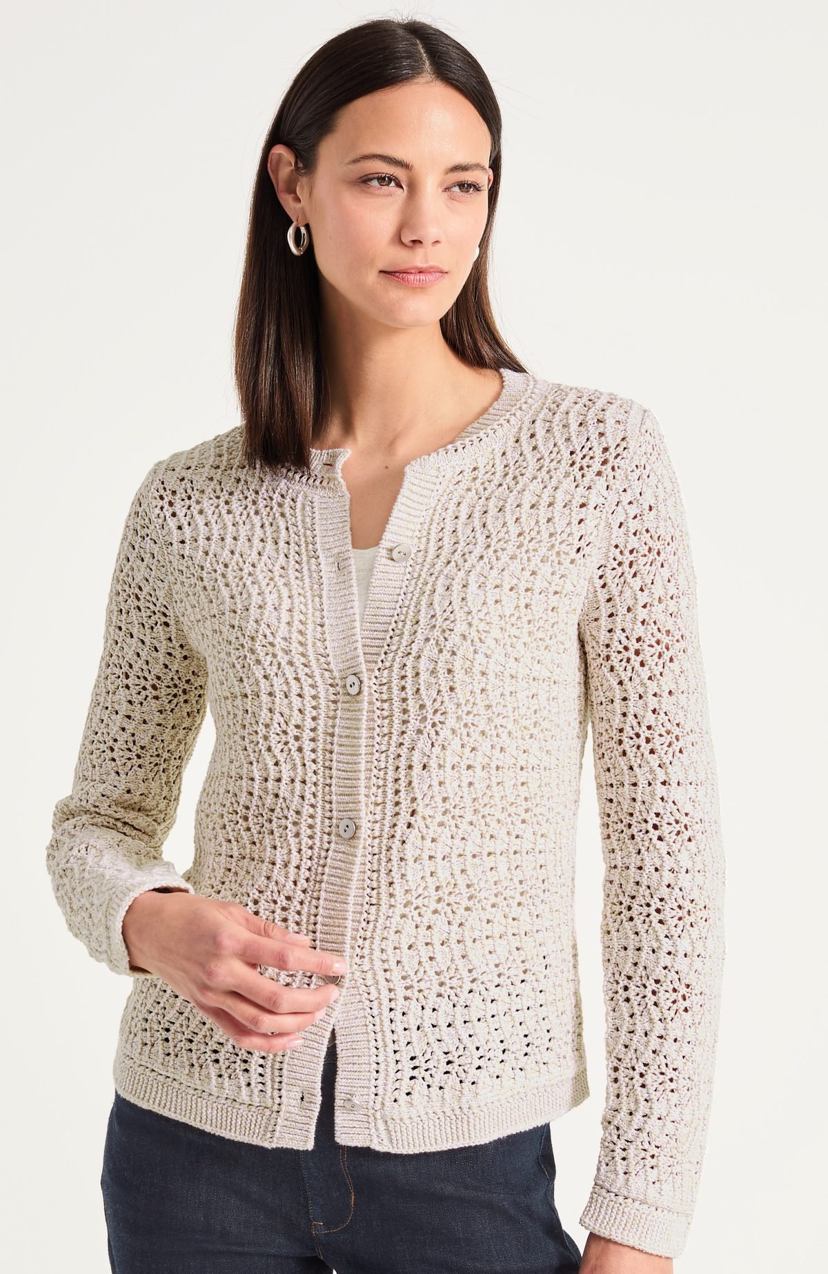 Hip length textured button cardigan in a cream marl, worn buttoned over a tee with slim pants, for women over 50.