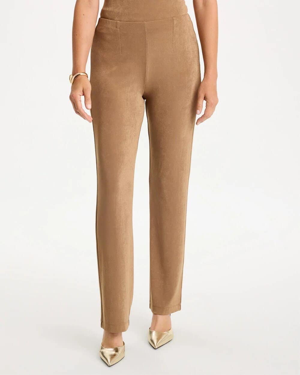 Woman over 50 wearing brown pull on pants with a flat tummy smoothing front and a burgundy sweater, a polished Thanksgiving hosting outfit.