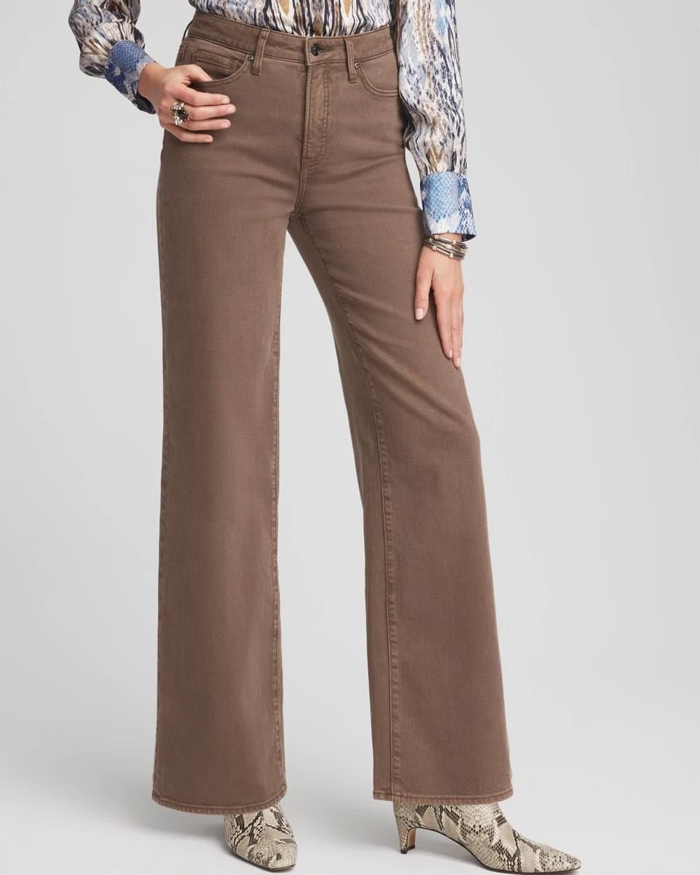 Brown high rise wide leg jeans with a front tucked top, a polished outfit for women over 50 with a tummy.