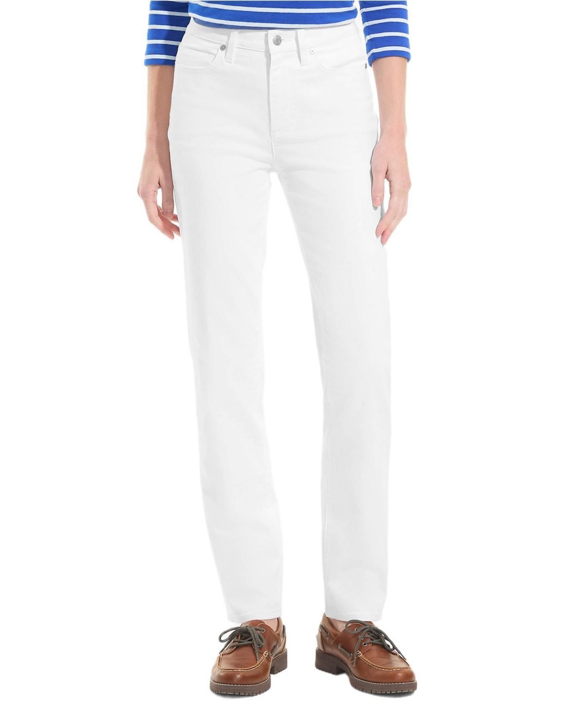 Woman over 50 wearing white high rise jeans with a burgundy cashmere sweater and waterproof booties.